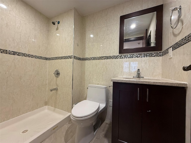 41-42 College Point Blvd Unit 3E, Flushing, NY 11355 - bathroom with tile walls, toilet, vanity, and a tile shower