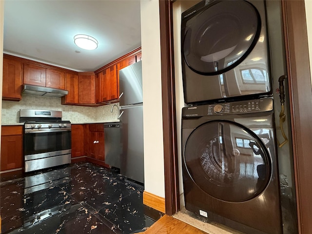 41-42 College Point Blvd Unit 3E, Flushing, NY 11355 - laundry room featuring estacked washer and dryer and baseboards