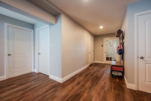 360 E Hudson St, Long Beach, NY 11561 - hallway with dark wood finished floors, baseboards, and recessed lighting