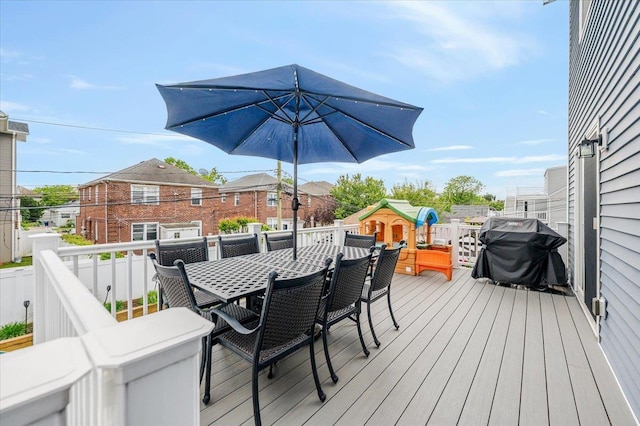 360 E Hudson St, Long Beach, NY 11561 - wooden terrace with outdoor dining area and a grill