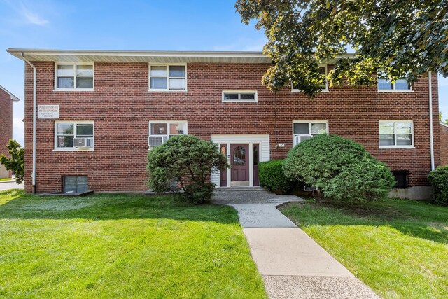 2 Cascade Ter Unit 1D, Yonkers, NY 10703 - view of front facade featuring a front lawn and brick siding