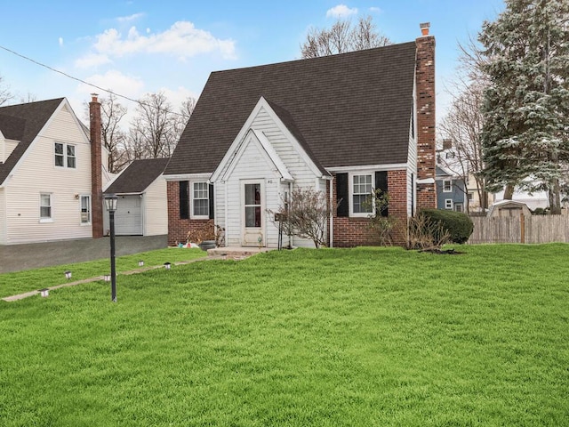 40 Mount Pleasant Rd, Yonkers, NY 10703 - cape cod-style house featuring brick siding, a chimney, a garage, and roof with shingles