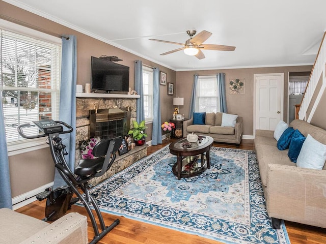 40 Mount Pleasant Rd, Yonkers, NY 10703 - living area featuring a ceiling fan, baseboards, a fireplace, ornamental molding, and wood finished floors
