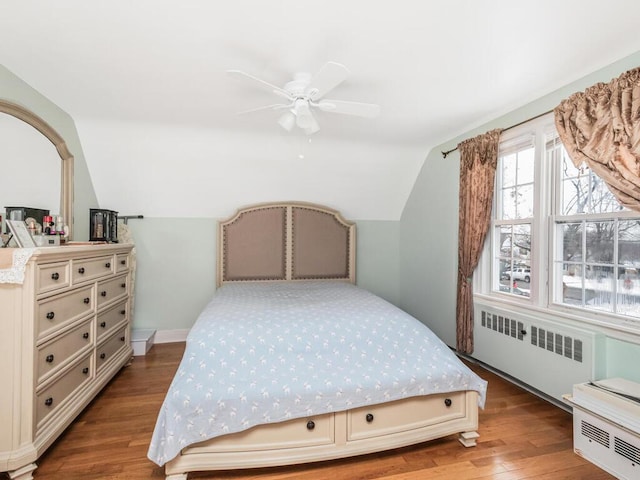 40 Mount Pleasant Rd, Yonkers, NY 10703 - bedroom with radiator, vaulted ceiling, wood finished floors, and ceiling fan
