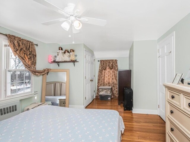 40 Mount Pleasant Rd, Yonkers, NY 10703 - bedroom with baseboards, wood finished floors, radiator, and a ceiling fan