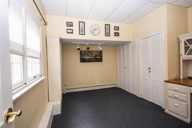 51 Regina Dr, Sayville, NY 11782 - unfurnished dining area with baseboard heating and track lighting