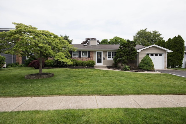 51 Regina Dr, Sayville, NY 11782 - single story home featuring asphalt driveway, a front lawn, a chimney, and a garage