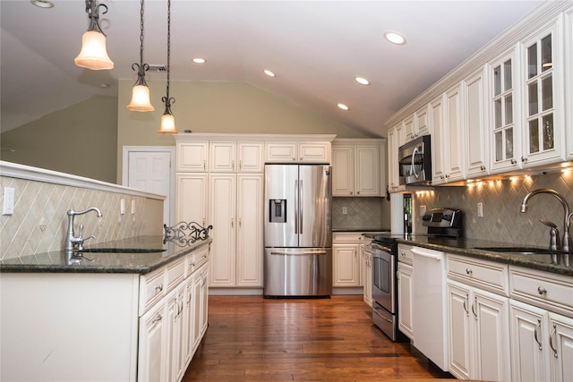 51 Regina Dr, Sayville, NY 11782 - kitchen with appliances with stainless steel finishes, a sink, lofted ceiling, tasteful backsplash, and recessed lighting