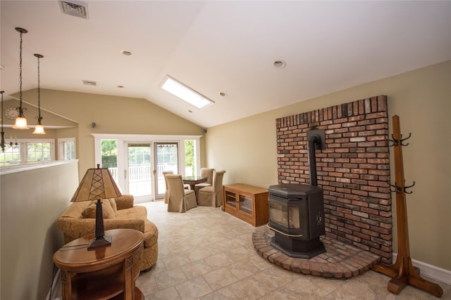 51 Regina Dr, Sayville, NY 11782 - living area featuring vaulted ceiling and a wood stove