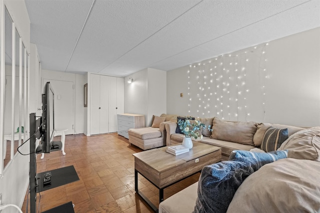 160 Academy St Unit 5C, Poughkeepsie, NY 12601 - living room featuring a textured ceiling