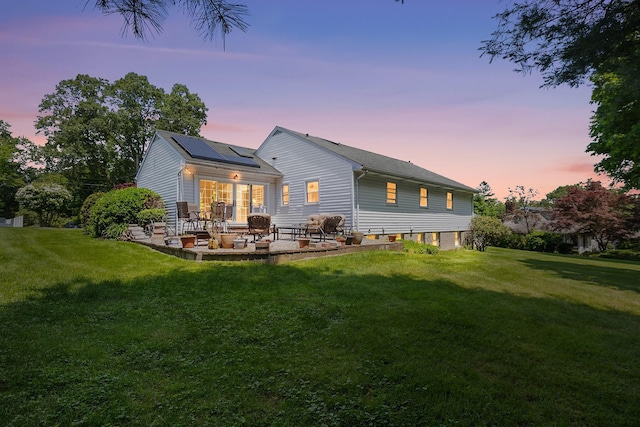 18 Halsey Pl, Valhalla, NY 10595 - back of house with a patio area, solar panels, and a lawn