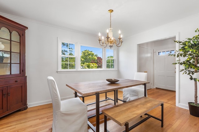 18 Halsey Pl, Valhalla, NY 10595 - dining space featuring a chandelier, crown molding, light wood-type flooring, and baseboards