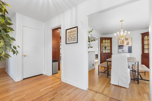 18 Halsey Pl, Valhalla, NY 10595 - dining area featuring light wood-type flooring, a chandelier, ornamental molding, and baseboards