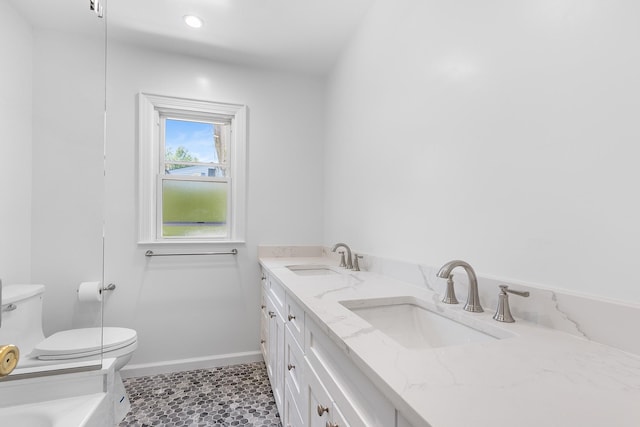 18 Halsey Pl, Valhalla, NY 10595 - full bathroom featuring toilet, double vanity, baseboards, recessed lighting, and a bath