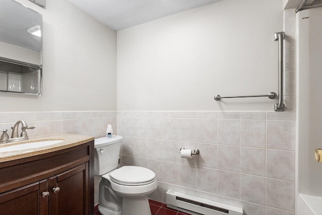 18 Halsey Pl, Valhalla, NY 10595 - full bath with a baseboard heating unit, tile walls, toilet, vanity, and tile patterned floors