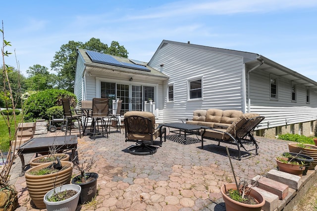 18 Halsey Pl, Valhalla, NY 10595 - back of property featuring solar panels, a patio, and an outdoor hangout area