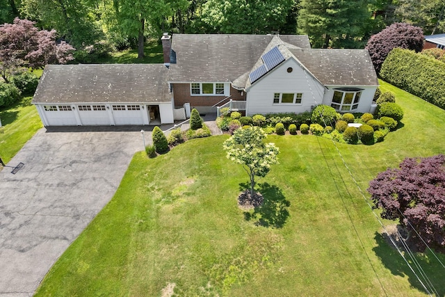18 Halsey Pl, Valhalla, NY 10595 - view of front of house featuring driveway, a chimney, a garage, and a front yard