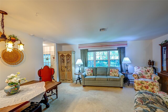 119 Exmore Ct Unit A, Ridge, NY 11961 - carpeted living area featuring plenty of natural light