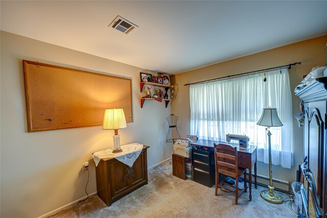 119 Exmore Ct Unit A, Ridge, NY 11961 - carpeted office with a baseboard heating unit and baseboards