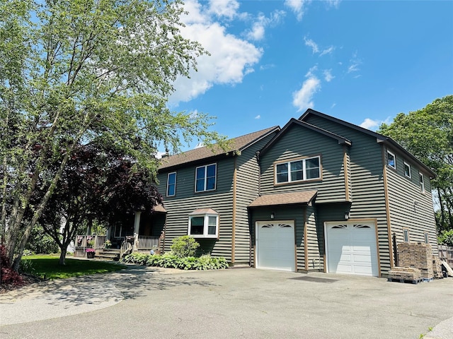 800 Bay Shore Ave, West Islip, NY 11795 - view of front of property featuring asphalt driveway and an attached garage