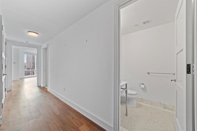 5 Renaissance Sq Unit 10G, White Plains, NY 10601 - hall with wood finished floors and baseboards