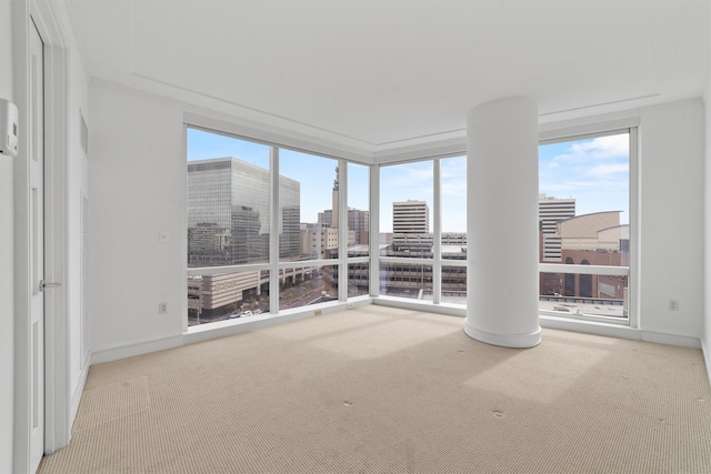 5 Renaissance Sq Unit 10G, White Plains, NY 10601 - carpeted empty room with baseboards, a city view, and a wall of windows