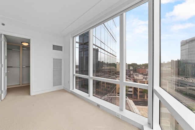 5 Renaissance Sq Unit 10G, White Plains, NY 10601 - unfurnished sunroom with carpet