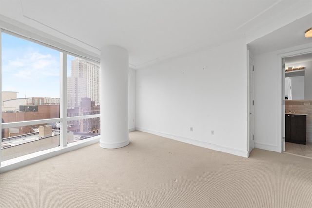5 Renaissance Sq Unit 10G, White Plains, NY 10601 - spare room featuring carpet flooring, a city view, and baseboards