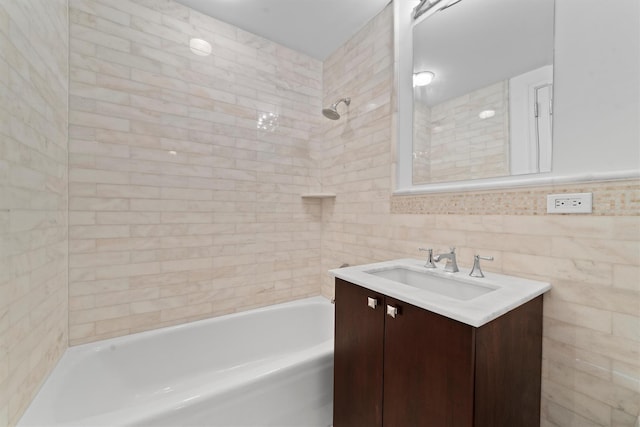 5 Renaissance Sq Unit 10G, White Plains, NY 10601 - full bathroom featuring vanity, shower / tub combination, and tile walls