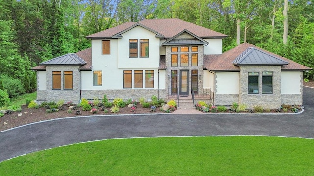 21 Arista Dr, Dix Hills, NY 11746 - view of front of property featuring stone siding, a standing seam roof, and stucco siding