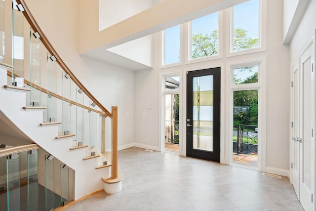 21 Arista Dr, Dix Hills, NY 11746 - foyer featuring a high ceiling, healthy amount of natural light, and stairs