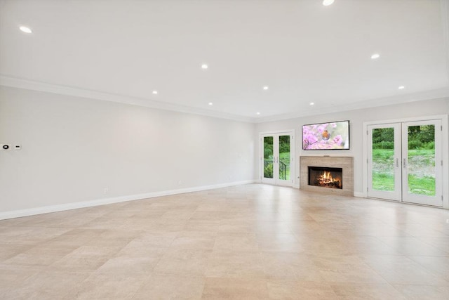 21 Arista Dr, Dix Hills, NY 11746 - unfurnished living room with crown molding, recessed lighting, a warm lit fireplace, and light tile patterned floors