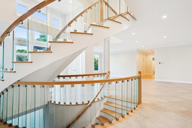 21 Arista Dr, Dix Hills, NY 11746 - stairway featuring a towering ceiling, recessed lighting, and crown molding