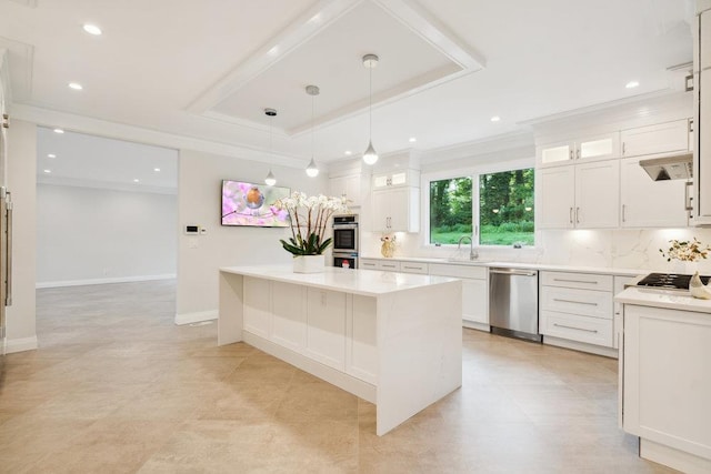 21 Arista Dr, Dix Hills, NY 11746 - kitchen featuring stainless steel appliances, a center island, white cabinetry, light countertops, and decorative backsplash