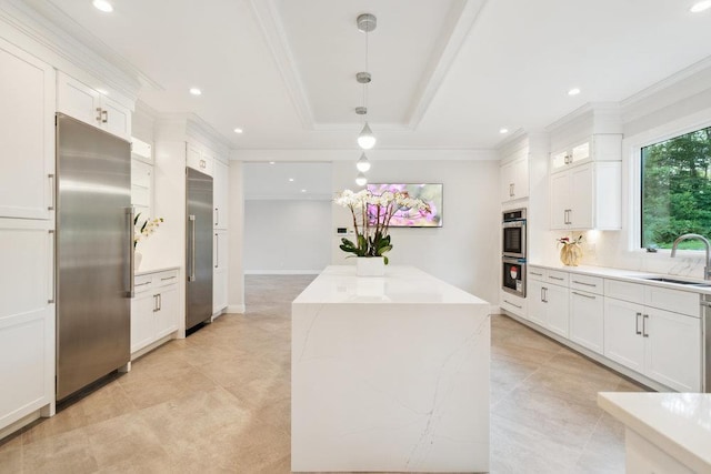 21 Arista Dr, Dix Hills, NY 11746 - kitchen featuring appliances with stainless steel finishes, a center island, ornamental molding, white cabinets, and tasteful backsplash