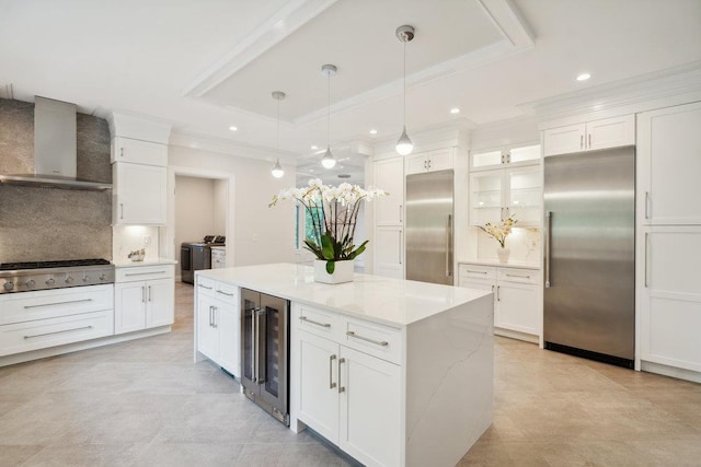 21 Arista Dr, Dix Hills, NY 11746 - kitchen with high end refrigerator, wall chimney exhaust hood, built in refrigerator, beverage cooler, and a tray ceiling
