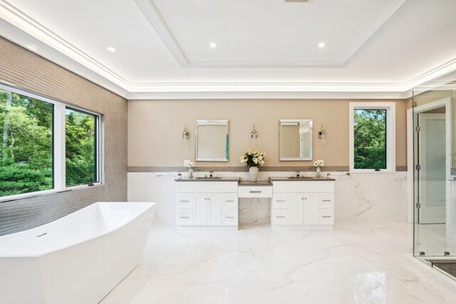 21 Arista Dr, Dix Hills, NY 11746 - full bath with tile walls, vanity, marble tiled floors, a freestanding bath, and a wainscoted wall