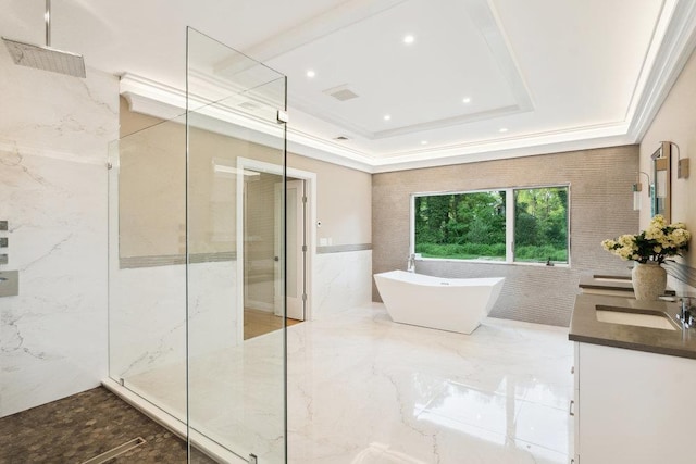 21 Arista Dr, Dix Hills, NY 11746 - bathroom with a marble finish shower, double vanity, a freestanding bath, tile walls, and a tray ceiling
