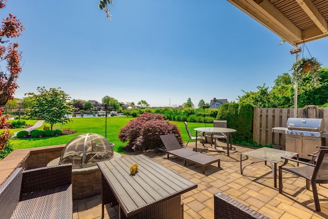 10 Hidden Harbor Dr Unit 10, Babylon, NY 11702 - view of patio featuring outdoor dining area and an outdoor fire pit