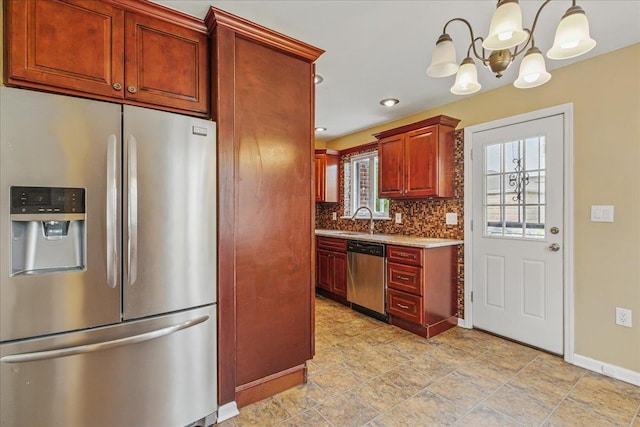 47-03 212th St, Bayside, NY 11361 - kitchen with appliances with stainless steel finishes, a chandelier, tasteful backsplash, dark brown cabinets, and hanging light fixtures