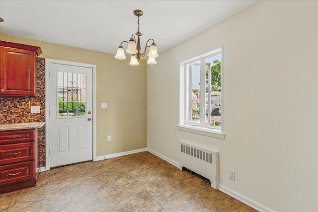 47-03 212th St, Bayside, NY 11361 - unfurnished dining area with radiator heating unit, healthy amount of natural light, and a chandelier