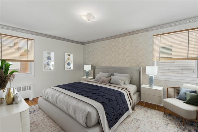 47-03 212th St, Bayside, NY 11361 - bedroom featuring radiator heating unit, wood finished floors, crown molding, and wallpapered walls