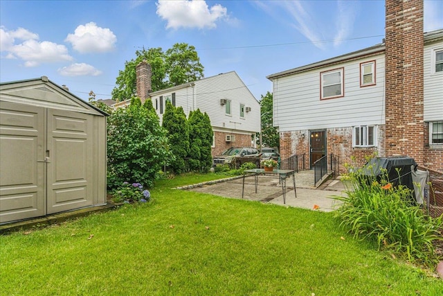 47-03 212th St, Bayside, NY 11361 - view of grassy yard with a storage unit and a patio area