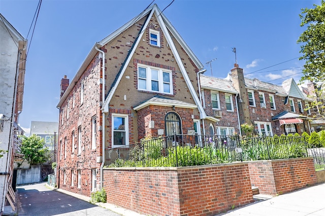 5428 65th Pl, Maspeth, NY 11378 - tudor home featuring brick siding and a residential view