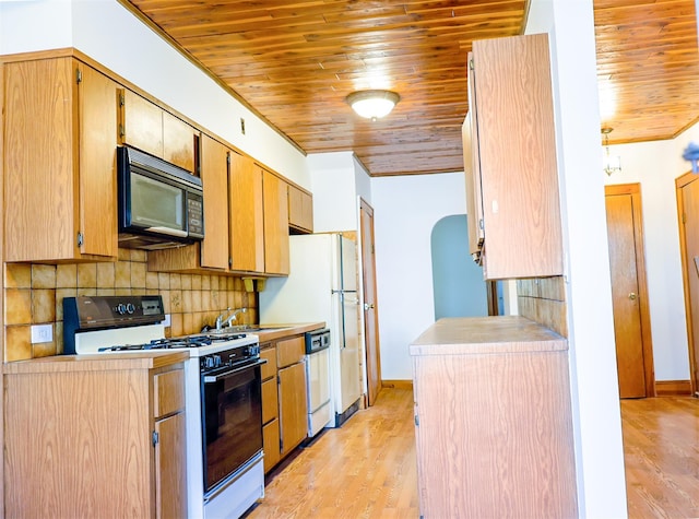 5428 65th Pl, Maspeth, NY 11378 - kitchen with range with gas stovetop, black microwave, wooden ceiling, a sink, and tasteful backsplash