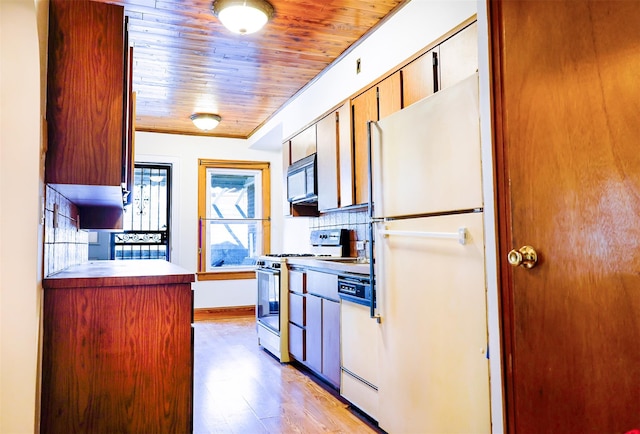5428 65th Pl, Maspeth, NY 11378 - kitchen with white appliances, wooden ceiling, light wood-style floors, decorative backsplash, and baseboards