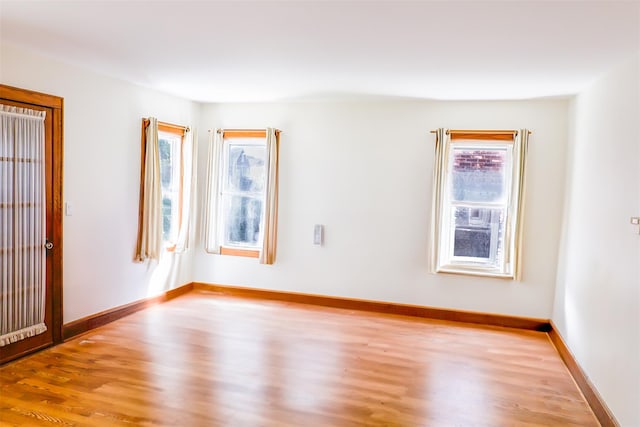 5428 65th Pl, Maspeth, NY 11378 - empty room featuring wood finished floors and baseboards