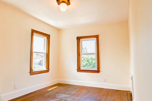 5428 65th Pl, Maspeth, NY 11378 - spare room with baseboards and hardwood / wood-style flooring