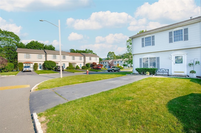 48 Zugibe Ct, West Haverstraw, NY 10993 - view of front of home with a residential view, a front lawn, and uncovered parking