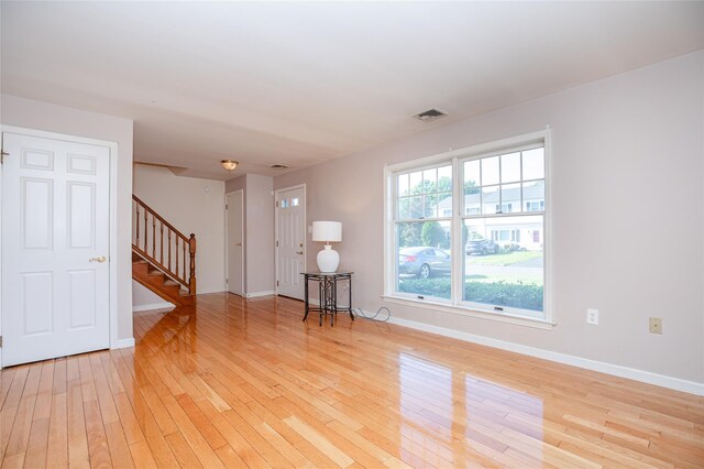 48 Zugibe Ct, West Haverstraw, NY 10993 - unfurnished room featuring stairway, light wood-style floors, and baseboards